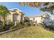 Charming single-story home showcasing a manicured lawn and attractive landscaping at 16182 Sw 14Th Ave Rd, Ocala, FL 34473