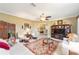 Bright living room with hardwood floors and built-in shelving at 16182 Sw 14Th Ave Rd, Ocala, FL 34473