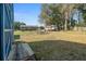 Spacious backyard with shed, fire pit, and camper at 17175 Ne Jacksonville Rd, Citra, FL 32113