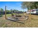 Relaxing backyard with fire pit and string lights, perfect for entertaining at 17175 Ne Jacksonville Rd, Citra, FL 32113