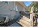 Wooden steps leading up to a deck and outdoor seating area at 17175 Ne Jacksonville Rd, Citra, FL 32113