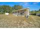 Single-story house with a shed in the backyard at 17175 Ne Jacksonville Rd, Citra, FL 32113