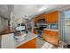 Kitchen with granite countertops and wood cabinets at 17175 Ne Jacksonville Rd, Citra, FL 32113