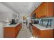 View of galley kitchen with stainless steel appliances at 17175 Ne Jacksonville Rd, Citra, FL 32113