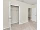 Bedroom with closet and access to another room at 27 Hickory Course Ln, Ocala, FL 34472