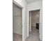 Bright hallway with access to bedroom closets and bathroom at 27 Hickory Course Ln, Ocala, FL 34472