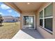 Covered patio with sliding glass doors at 27 Hickory Course Ln, Ocala, FL 34472