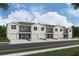 Modern townhome community with attached garages and appealing street landscaping at 3290 Bertram Rd, Wildwood, FL 34785