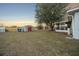 Backyard with shed, screened porch, and tree at 37 Willow Run, Ocala, FL 34472