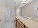 Bright bathroom with tub, shower, and wood vanity at 37 Willow Run, Ocala, FL 34472