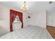 Bright dining area with tile floors and a chandelier at 37 Willow Run, Ocala, FL 34472