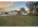 House exterior with gray garage door and red front door at 37 Willow Run, Ocala, FL 34472