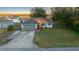 House exterior with gray garage door and red front door at 37 Willow Run, Ocala, FL 34472