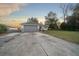 House exterior with gray garage door and red front door at 37 Willow Run, Ocala, FL 34472