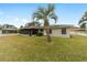 Home's exterior and backyard view at 5041 County Road 114, Wildwood, FL 34785