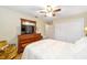 Comfortable bedroom with a queen-size bed and built-in closet at 5041 County Road 114, Wildwood, FL 34785