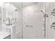 Large walk-in shower with marble tile and built-in seat at 5041 County Road 114, Wildwood, FL 34785