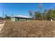 View of the home from the backyard at 53 Guava Pl, Ocklawaha, FL 32179