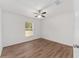 Bright bedroom with wood-look floors and ceiling fan at 53 Guava Pl, Ocklawaha, FL 32179