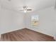 Bright bedroom with wood-look floors and window at 53 Guava Pl, Ocklawaha, FL 32179