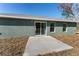 House exterior with sliding glass doors and patio at 53 Guava Pl, Ocklawaha, FL 32179