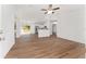 Open living room with hardwood floors and ceiling fan at 53 Guava Pl, Ocklawaha, FL 32179