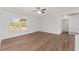 Bright living room with hardwood floors and large window at 53 Guava Pl, Ocklawaha, FL 32179