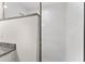 Walk-in shower with white tile and granite seat at 53 Guava Pl, Ocklawaha, FL 32179