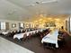 Large community room with tables and chairs, perfect for events at 6082 Sw 104Th St, Ocala, FL 34476