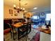 Bright dining room with a rustic wooden table and chandelier at 6180 Sw 110Th St, Ocala, FL 34476