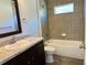 Bathroom features a bathtub, single vanity, and tile flooring at 6189 Sw 134Th St, Ocala, FL 34473