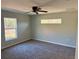 Spacious bedroom with ceiling fan and large window at 6189 Sw 134Th St, Ocala, FL 34473