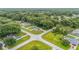 Aerial view of a house and surrounding neighborhood, showing its location and proximity to other homes at 66 Teak Loop, Ocala, FL 34472