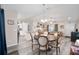 Open concept dining area flows into living room and kitchen at 66 Teak Loop, Ocala, FL 34472