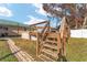 Wooden deck with stairs leading to the pool at 73 Bahia Trace Crse, Ocala, FL 34472