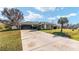 House exterior with driveway and landscaping at 73 Bahia Trace Crse, Ocala, FL 34472