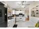 White kitchen with stainless steel appliances and a breakfast bar at 73 Bahia Trace Crse, Ocala, FL 34472