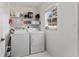 Laundry room with washer, dryer, and shelving for storage at 73 Bahia Trace Crse, Ocala, FL 34472