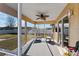 Relaxing screened porch with two comfy armchairs at 73 Bahia Trace Crse, Ocala, FL 34472