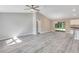 Spacious living room with light gray walls and wood-look floors at 753 Nw 63Rd Pl, Ocala, FL 34475