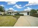 Ranch-style home with a covered porch and attached garage at 8188 Sw 108Th Loop, Ocala, FL 34481