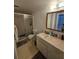 Bathroom with shower, sink, and large mirror at 8208 Fairways Cir # B101, Ocala, FL 34472