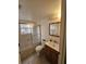 Bathroom with shower/tub combo, vanity, and mirror at 8208 Fairways Cir # B101, Ocala, FL 34472