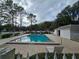 Inviting community pool with surrounding landscaping at 8208 Fairways Cir # B101, Ocala, FL 34472