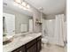 Simple bathroom with single vanity, tub shower combo, and neutral colors at 8405 Sw 59Th Ter, Ocala, FL 34476