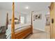 Charming bedroom featuring a wooden post bed and neutral decor at 8405 Sw 59Th Ter, Ocala, FL 34476