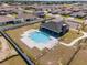 Aerial view of community pool with a covered patio and lounge chairs at 8405 Sw 59Th Ter, Ocala, FL 34476