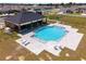 An aerial view of the community pool with surrounding patio and lounge chairs at 8405 Sw 59Th Ter, Ocala, FL 34476