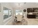 Bright dining area with a round table and four chairs near kitchen at 8405 Sw 59Th Ter, Ocala, FL 34476