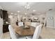 Open concept dining room with round table and four chairs at 8405 Sw 59Th Ter, Ocala, FL 34476